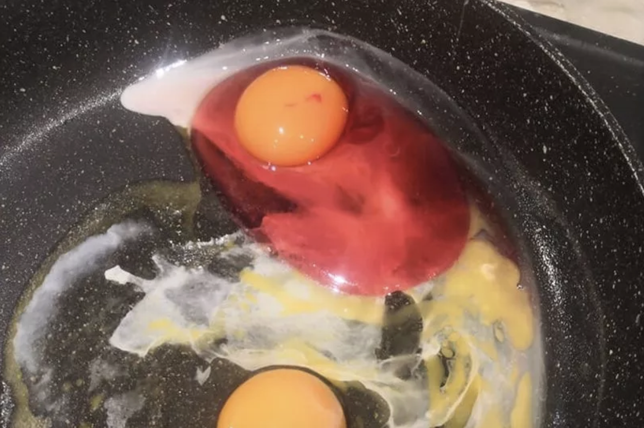 pink egg in a frying pan